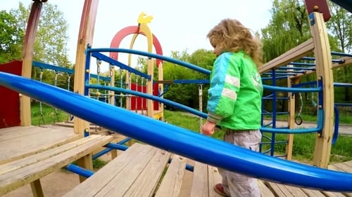 Child Exploring Playground on Sunny Day