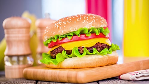 Delicious Burger with Cheese, Lettuce and Tomato