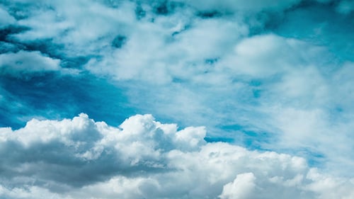 Clouds Float Through Azure Blue Daytime Sky