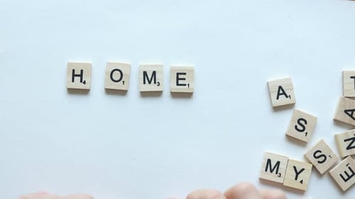 composing word homework with wooden letters
