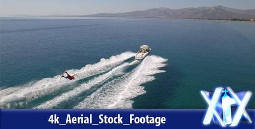 Boat Pulling a Water Skier Across the Ocean