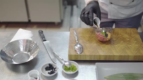 Chef Prepares Gourmet Dish in Restaurant Kitchen