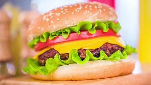 Delicious Hamburger on a Cutting Board
