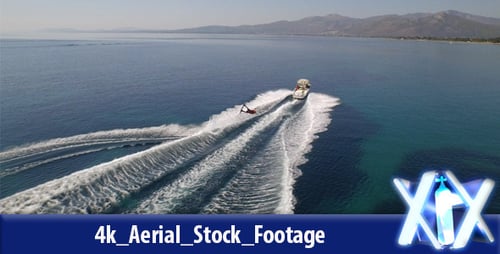 Aerial View of Water Skier Pulled by Motorboat
