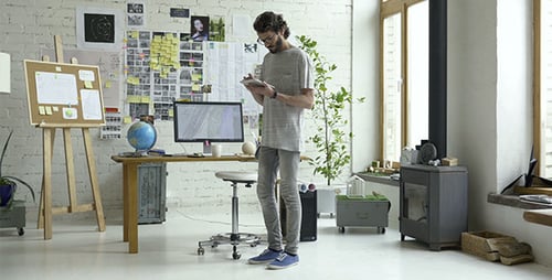 Designer Using Tablet in Bright Modern Office