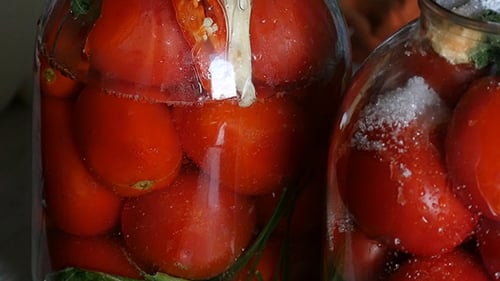 Preserving Fresh Ripe Red Tomatoes in Glass Jars