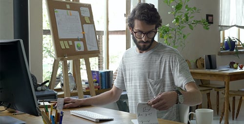 Man Working at Computer in Bright Home Office