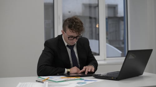 Businessman Using Tablet for Business
