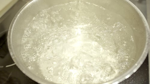 Boiling Water in a Silver Cooking Pot