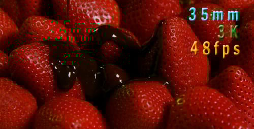 Chocolate Being Poured on Ripe Red Strawberries