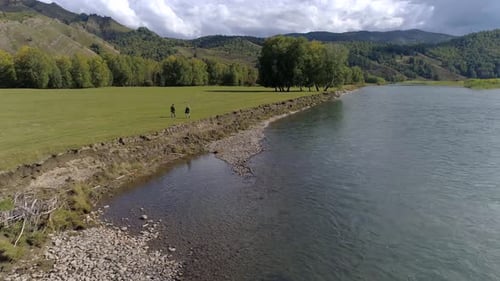 Two Fishermen Go on the River Bank