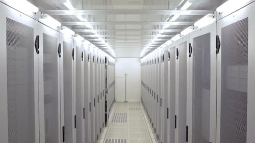 Hallway Lined with Rows of Server Racks