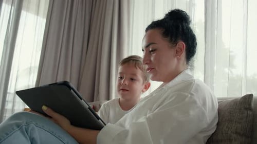 Mother and Child Using Tablet at Home