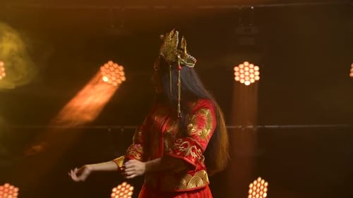 Theatrical Performance Woman Dancer in Red Silk Costume and Headdress of a Chinese princess.China