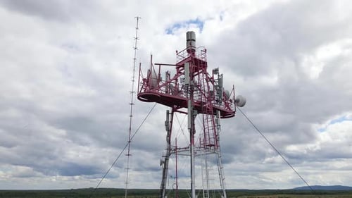 Aerial View of Telecommunications Cell Phone Tower with Wireless Communication Antennas for Network