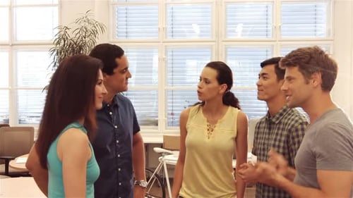 Enthusiastic Young Team Celebrates Success in Office