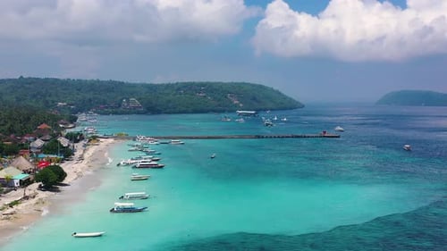 Coast and fishing boats as a background from top view. Turquoise water background from top drone.