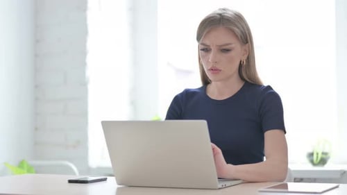 Young Woman Frustrated While Using Computer