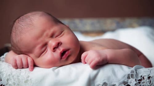 Beautiful Sleeping Baby on Vintage Suitcase