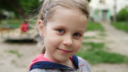 Little Girl Playing on Playground