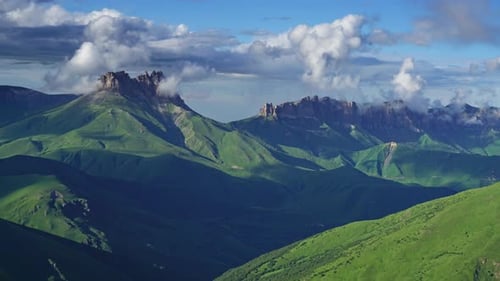 Majestic Green Mountains and Dramatic Sky