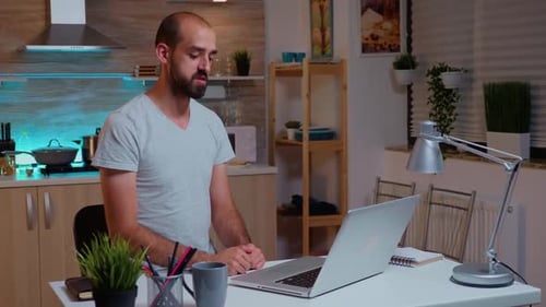 Man Talking During Video Conference at Home