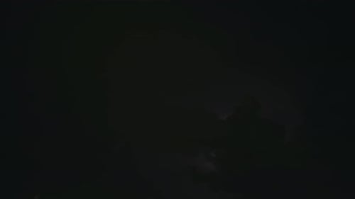 Lightning Flashes in Dark Stormy Night Sky