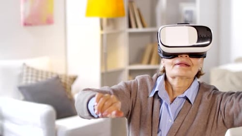 Senior Woman Exploring Virtual Reality at Home