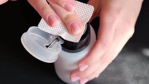 Woman Removes Nail Polish at Home