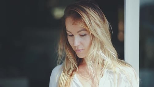 Close Up of a Blond Haired Woman Indoors