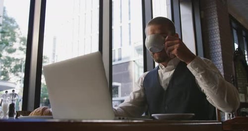 Young professional man in a cafe