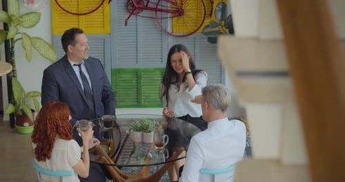 Team Having a Business Meeting in Bright Office