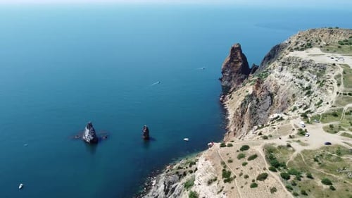 Aerial View From Above on Calm Azure Sea and Volcanic Rocky Shores