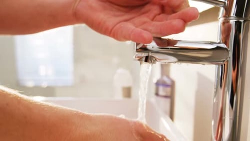 Adult Hand Washing Hygiene Routine in Bathroom