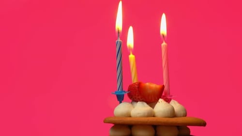 Birthday Cake with Candles on Pink Background