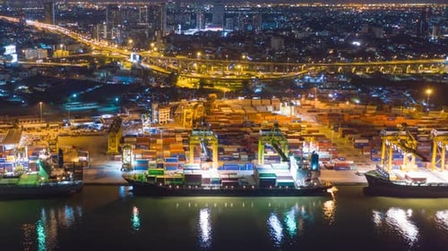 Aerial view, cargo dock and work during twilight With the backdrop