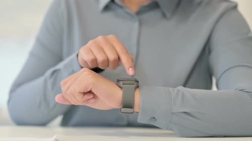 Close Up of African Woman Using Smart Watch