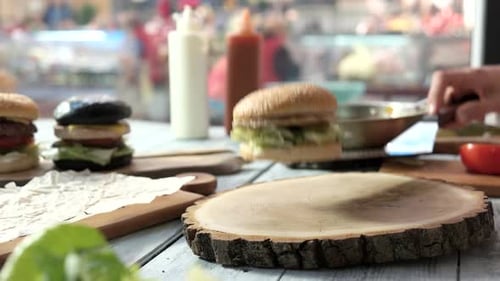 Burgers Stacked Artfully on a Table in Urban Restaurant