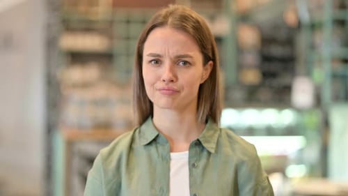 Woman Looking Concerned and Making Sad Faces