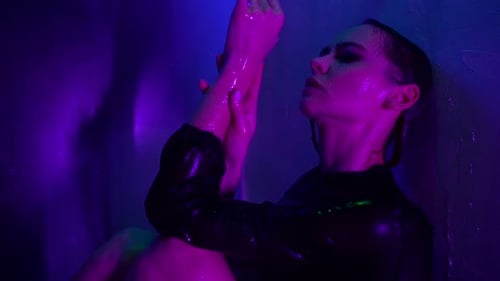 Woman in Shower with Purple and Blue Lights
