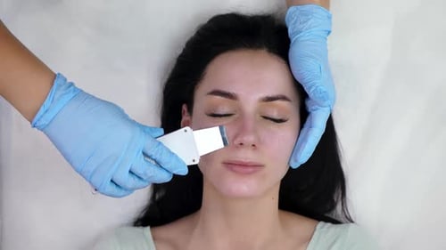 Woman Receiving Ultrasonic Facial Treatment for Skincare
