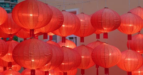 Glowing Red Chinese Lanterns Decorate Urban Area