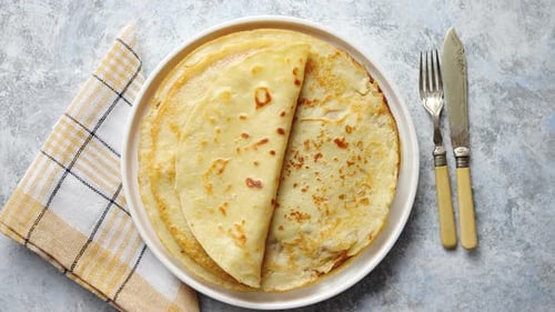Fresh Homemade Crepes, Thin Pancakes Placed on White Ceramice Plate