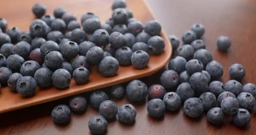 Fresh Blueberries on Wooden Surface, Close Up Shot