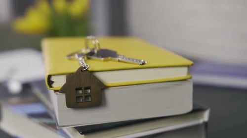 Books and House Keys for Real Estate