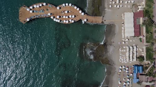 Drone View of Umbrellas on the Beach and on the Pier