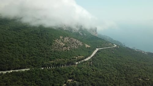 A Winding Road Through the Crimean Mountains Along the Sea