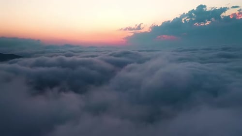 Aerial View Above Clouds at Sunset