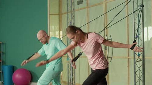 Woman Doing Exercises with Physical Therapist