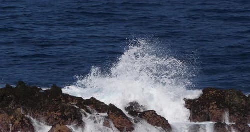 Wave crash into rock coastline, Atlantic Ocean, Porto Moniz, Madeira Island Portugal, Slow Motion 4K
